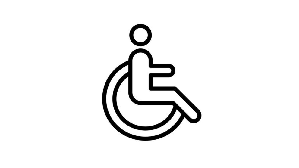 Man sieht ein Piktogramm einer Person im Rollstuhl.